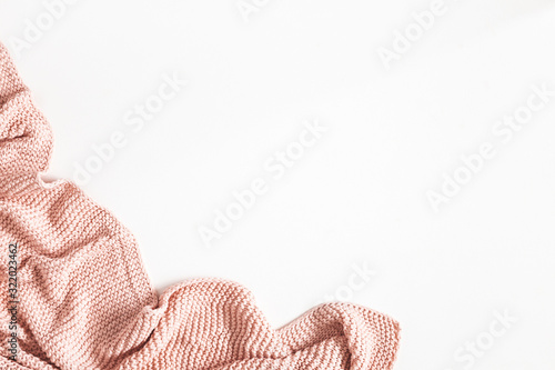 Pink blanket on white background. Flat lay, top view photo