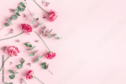 Obraz na płótnie Flowers composition. Pink flowers and eucalyptus branches on pink background. Valentines day, mothers day, womens day concept. Flat lay, top view
