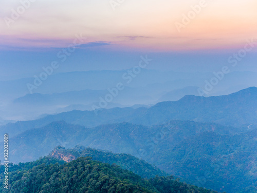 beautiful nature of hills and complex mountain with the morning mist atmosphere in Tak, Thailand.