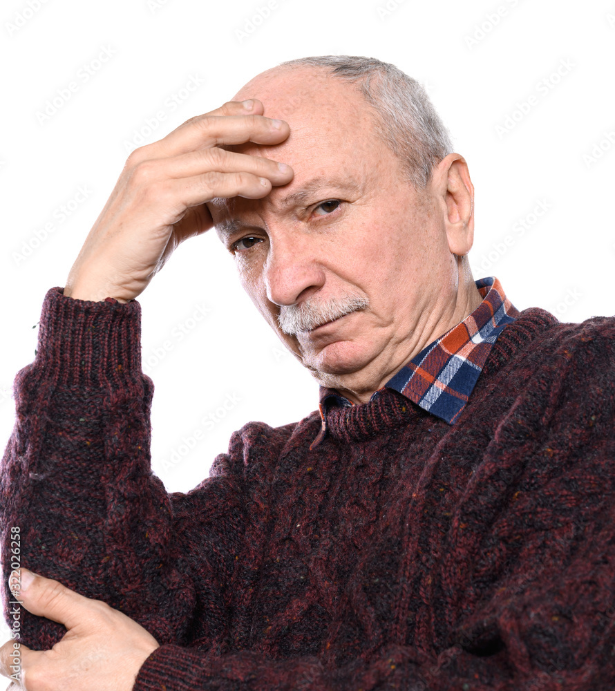 Sad lonely elderly man posing in studio on a white background Sad lonely elderly man posing in studio on a white background