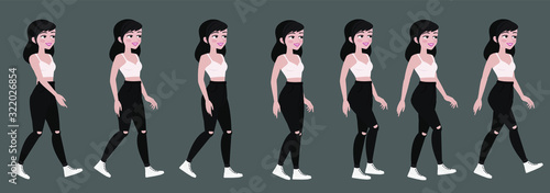 Gait beautiful student girl in trendy clothes. Teenager or fan in black jeans, animated walking.