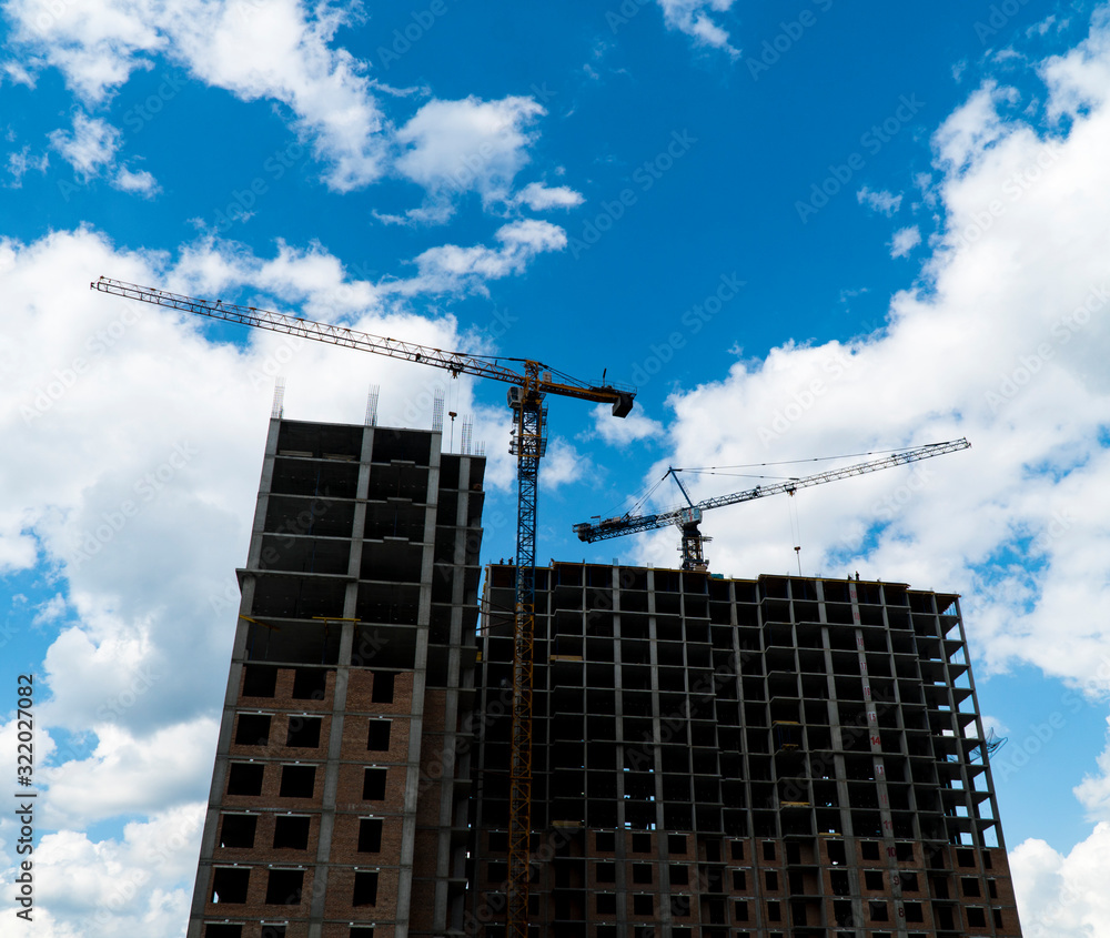 Photo of a multi-storey building under construction Photo of a multi-storey building under construction
