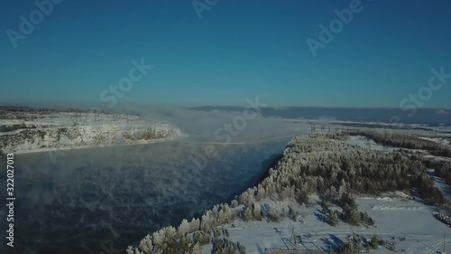 Steam over the river and a view of the city of Bratsk. photo