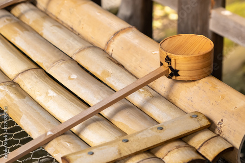 Purification water wooden scoop in Japanese shrine and temple photo