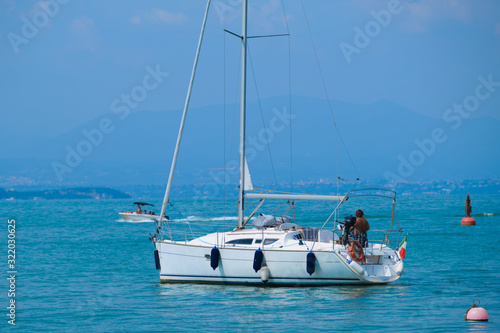 White yacht on blue water in motion