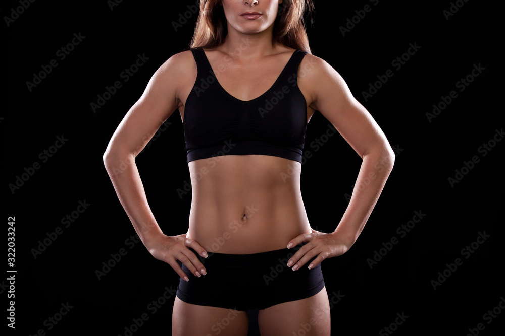 Torso of a girl on a black background
