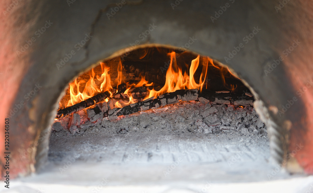 fireplace with log wood burning clay stove fire in home in the winter -  fireplace room concept Stock Photo | Adobe Stock