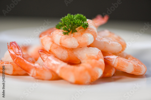 Photography fresh shrimps served on plate - boiled peeled shrimp prawns cooked in the seafoo