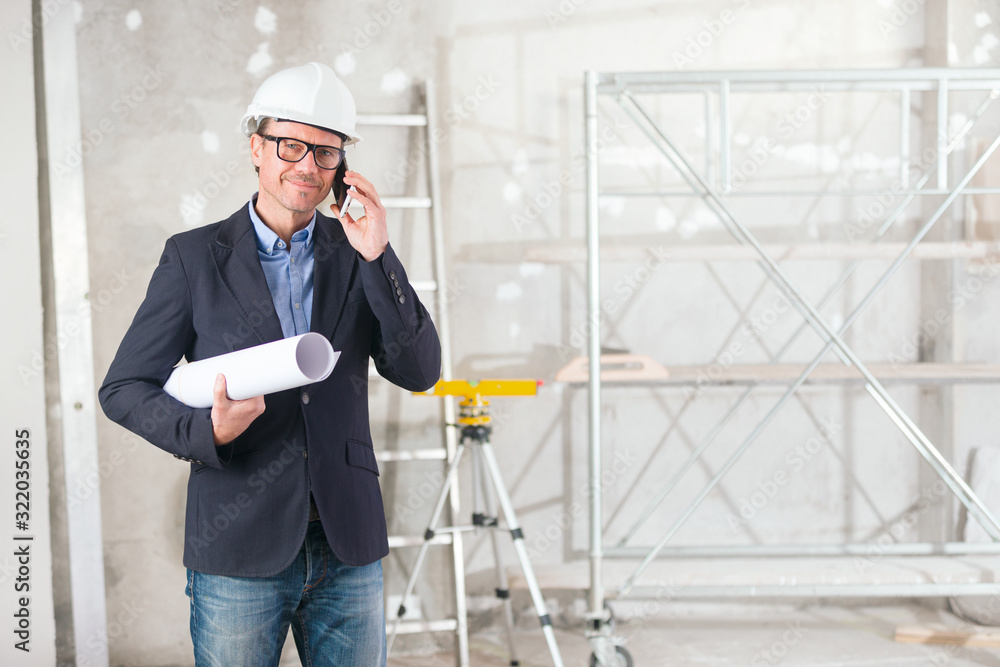 Fotografija Architect or engineer discussing a blueprint