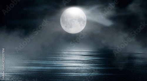 Dramatic nature background. Terrible forest at night. Cloudy night sky, moonlight, reflection on the pavement. Smoke and fog on a dark street at night.