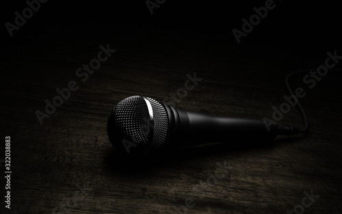 Microphone on wood background. 3d render