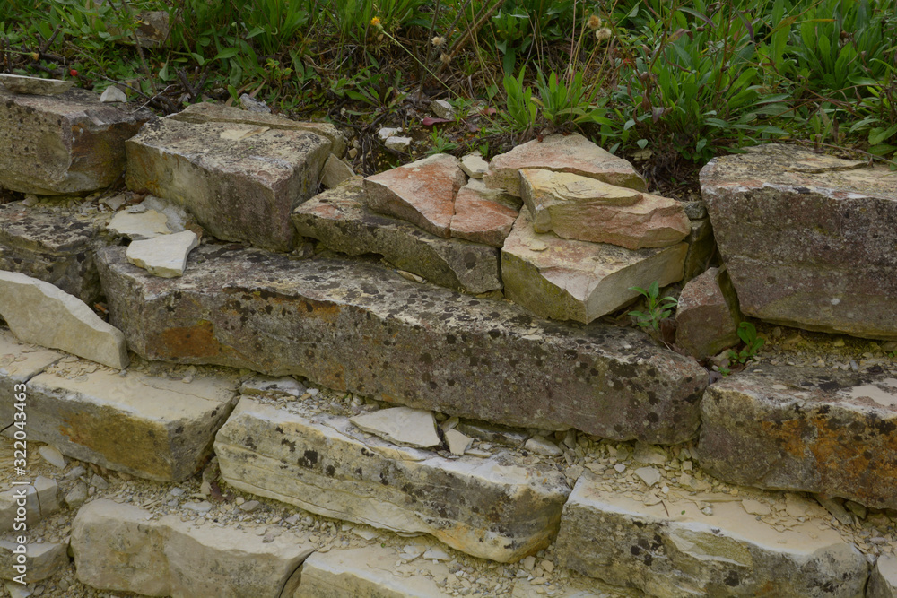 close-up view of lost place rock wall with broken tiles, abandoned scruffy and broken rock wall close-up view of lost place rock wall with broken tiles, abandoned scruffy and broken rock wall