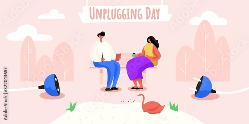 Man and woman sitting on the bench in park, having coffee and chatting without any devices. Plug disconnected from socket. Unplugging day banner. Get real instead of browsing social media content.