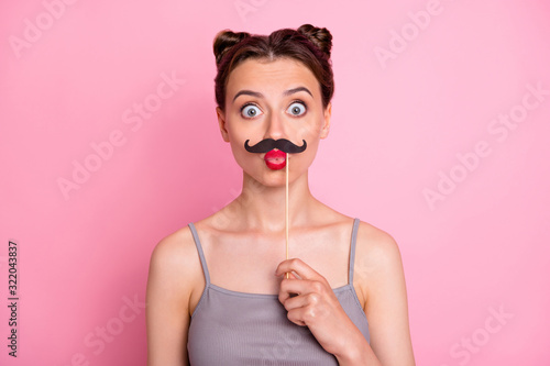 Portrait of funny teen girl hold mustache mask feel fun celebrate valentine summer day party send air kisses wear casual style outfit isolated over pastel color background photo
