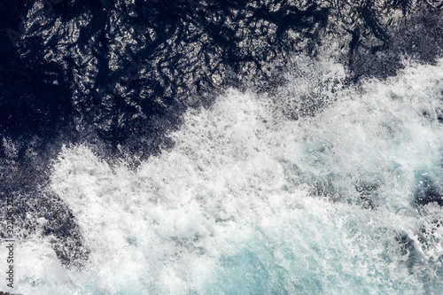 top view of the ocean with large waves from the ship. sea background. © Andriy Medvediuk