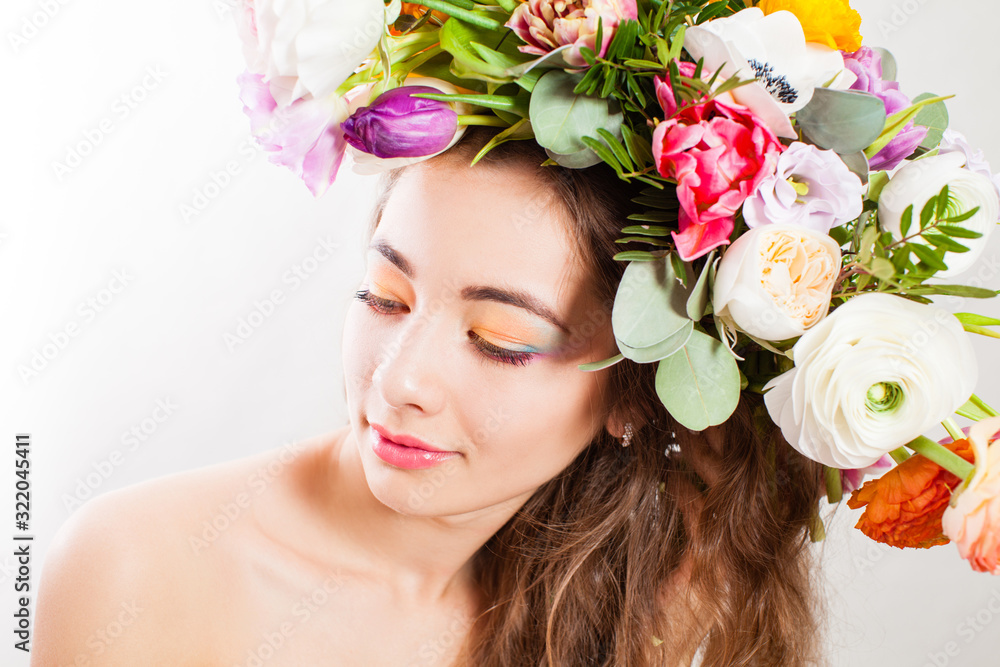 Sensual girl's face with spring flowers close up