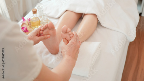 Close up Young woman getting Foot Reflexology massage at beauty spa salon. Massage for health