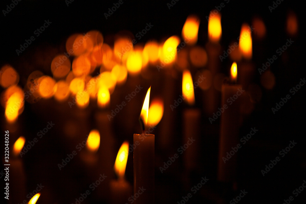 candles with lights on the dark background candles with lights on the dark background