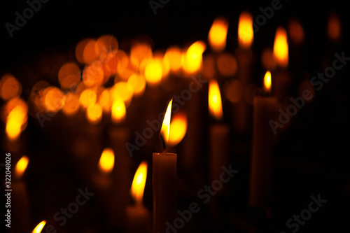 candles with lights on the dark background