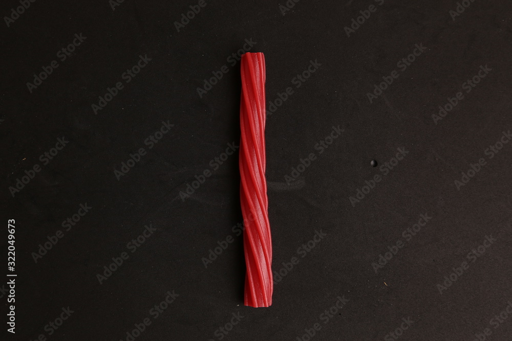 sweet red gummy licorice in color background