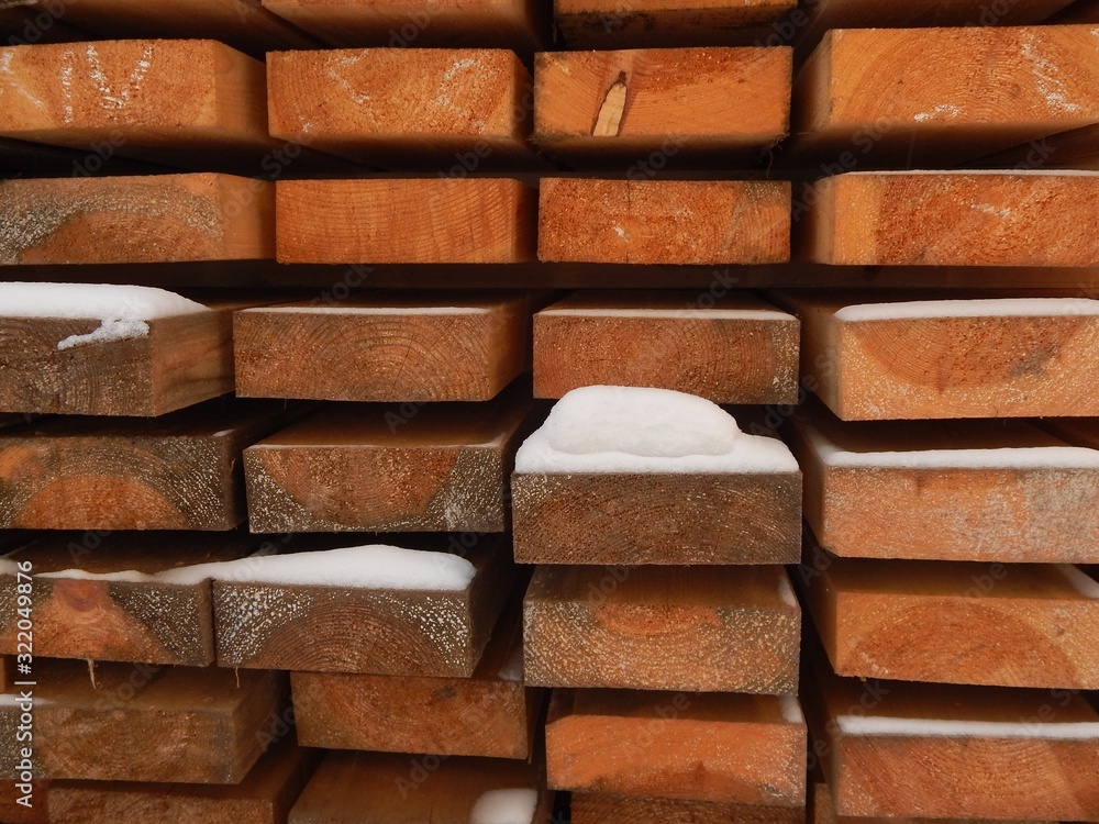 voluminous background of the end parts of long wooden blocks with a snow coating voluminous background of the end parts of long wooden blocks with a snow coating