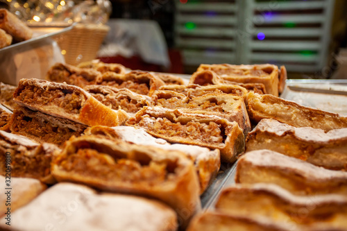 Photography Traditional hungarian strudel with apple filling on christmas market