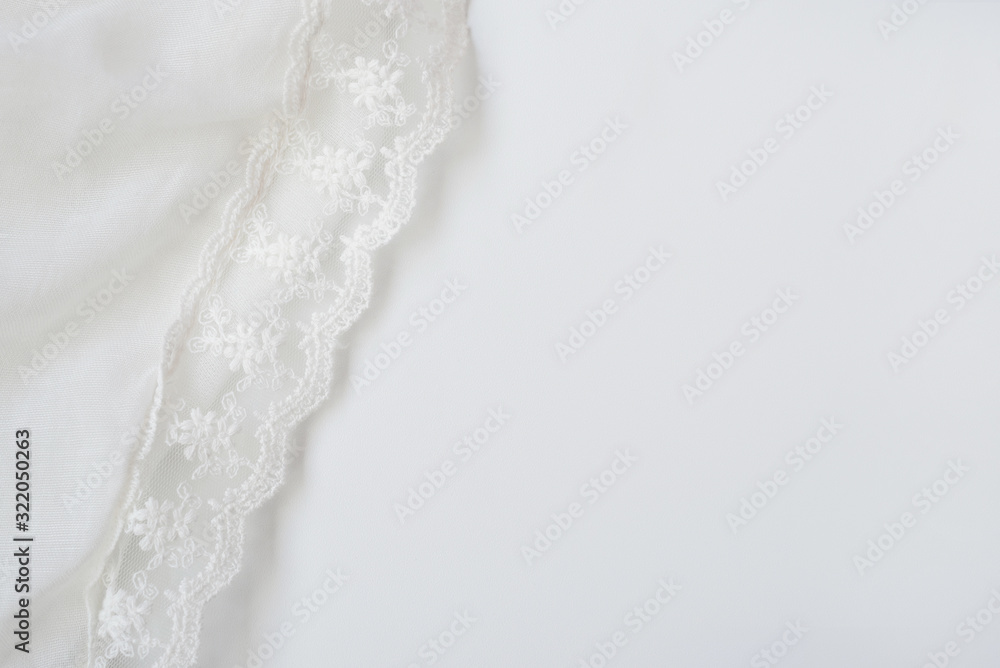 Fototapeta premium White soft wrinkle thin fabric blanket texture background, wallpaper, backdrop. Space for text.