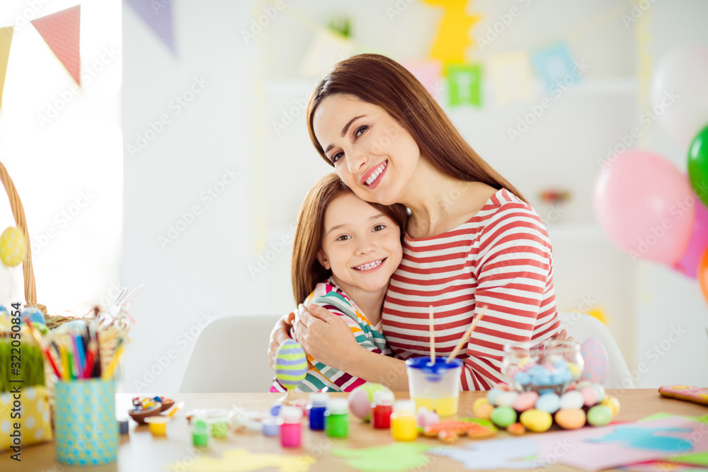 Fototapeta premium Close-up portrait of nice attractive lovely gentle affectionate sweet cheerful cheery girls small little daughter making handicraft spending day embracing in white light interior room house indoors