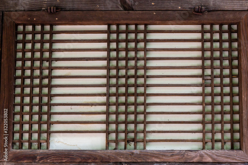 Traditional korean architecture, fragment of wooden wall in Bukchon Hanok Village in Seoul, South Korea.