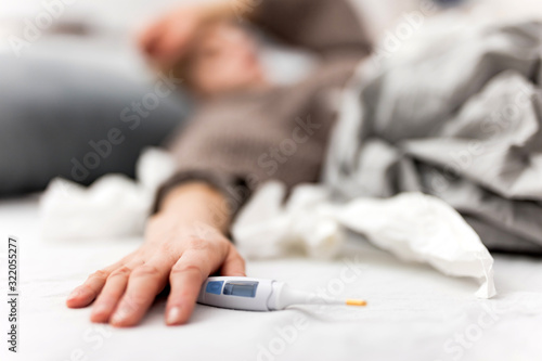 Woman sick in the bed  flu and virus infections  allergy  seasonal healt issues.