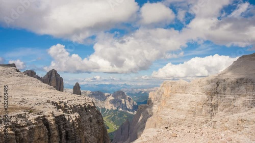 Clouds over Sella Ronda and Fassa valley in background, summer time lapse Dolomite Alps, Italy 4K photo