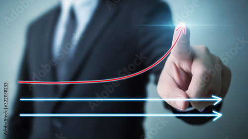 Obraz na płótnie Businessman pointing arrow moving up growing business growth