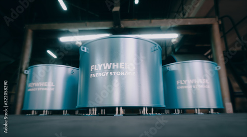 Concept of a flywheel energy storage system with industrial interier in background. 3d rendering.