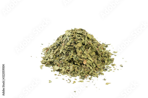 dried lovage herb heap of isolated on white background. front view. spices and food ingredients