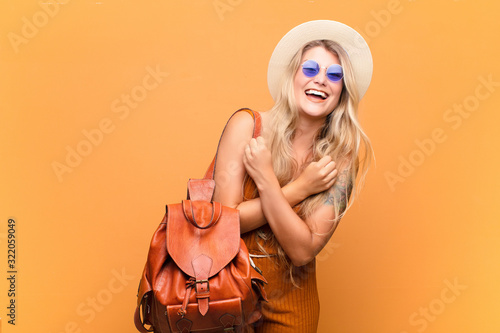 Photos young pretty latin woman smiling cheerfully and celebrating, with fists clenched and arms crossed, feeling happy and positive