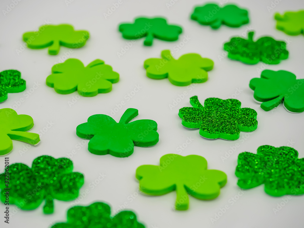 Green and Glittery four leaf clovers on a white background for St. Patrick’s Day! Green and Glittery four leaf clovers on a white background for St. Patrick’s Day!