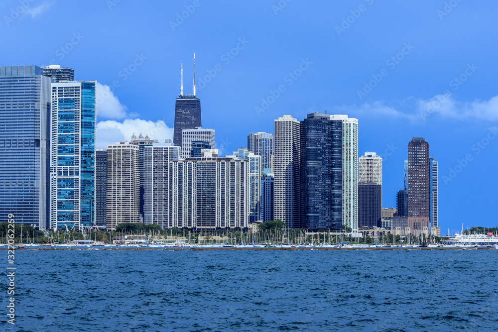 Obraz premium Blue Light to the Business Buildings of the Chicago City, USA