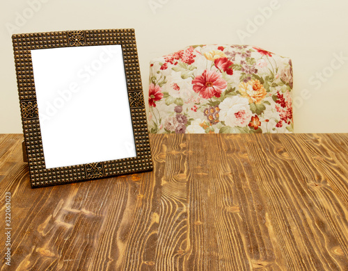 Vintage photo frame on wooden table. photo