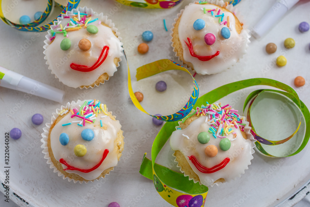 carnival clown muffins decorated with multi colored chocolate lentils