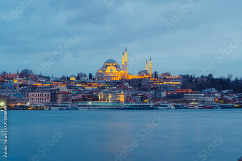 Istanbul, Turkey - Jan 16, 2020: Suleymaniye mosque and passengers Ferry at the Golden Horn, Istanbul, Turkey.