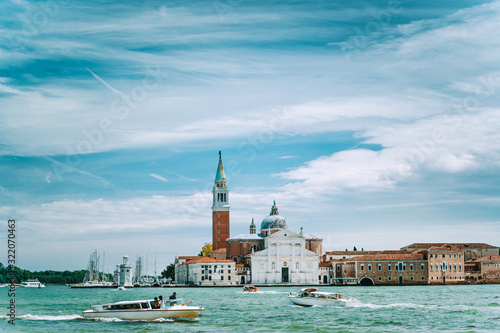 Venice, Italy. Chiesa di San Giorgio Maggiore or San Giorgio Maggiore island against blue sky and white clouds