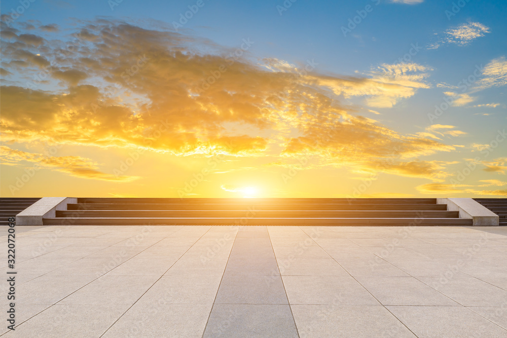 Empty square pavement and colorful sky at summer sunset