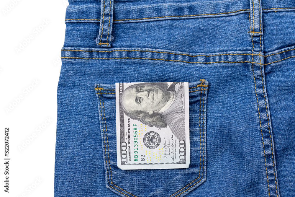 One hundred dollar banknote money in pocket jeans pants background texture. 100 dollar bill close up One hundred dollar banknote money in pocket jeans pants background texture. 100 dollar bill close up