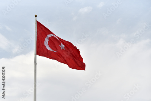 Big flag of Republic of Turkey on sky background