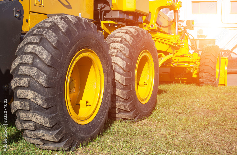 new modern grader for planning and moving soil. Road construction and leveling, industry new modern grader for planning and moving soil. Road construction and leveling, industry