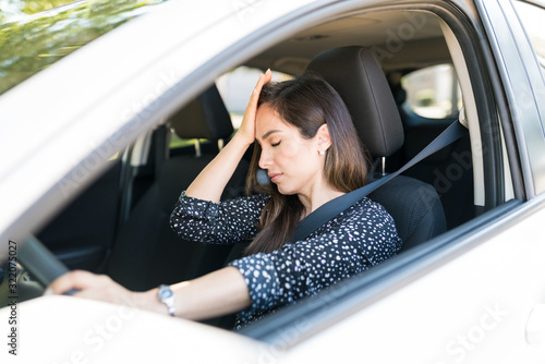 Frustrated Woman In Car At Traffic