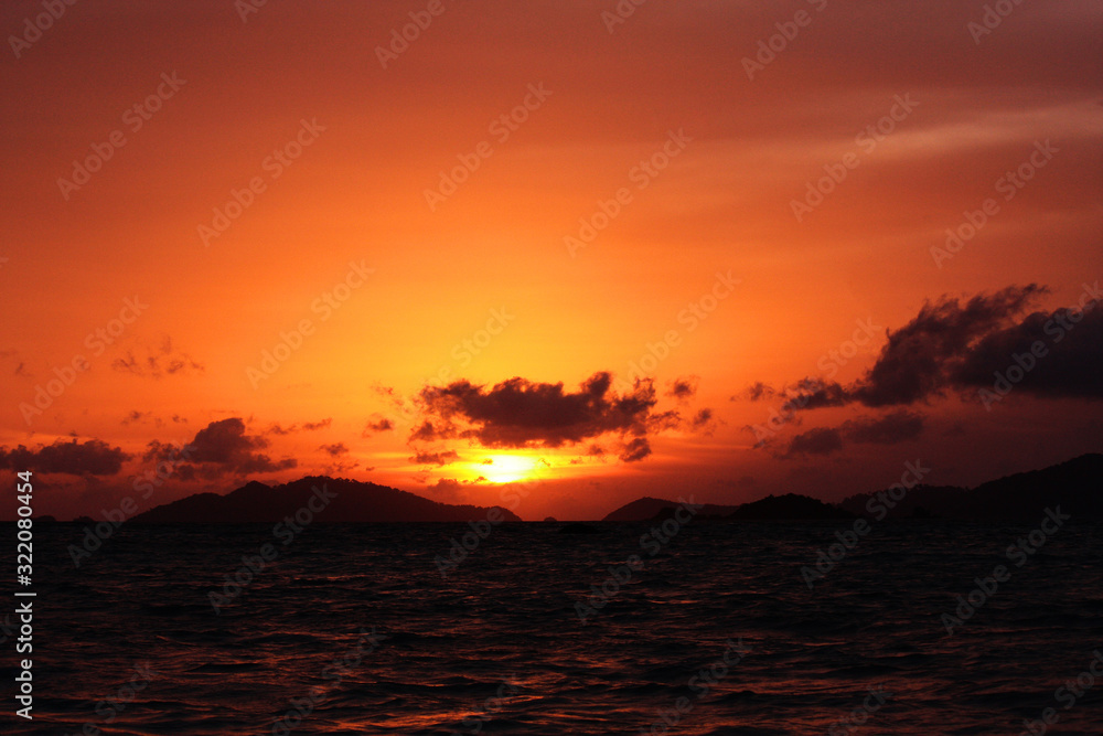 Beautiful seascape and tropical island with sky in twilight of sunset over the mountain in sea at Thailand