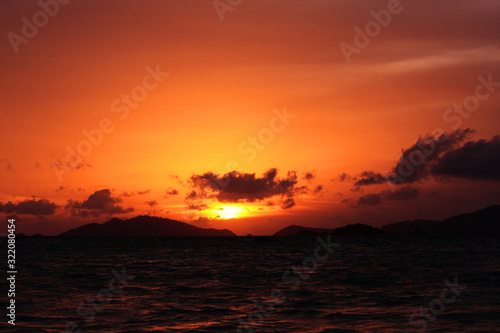 Beautiful seascape and tropical island with sky in twilight of sunset over the mountain in sea at Thailand