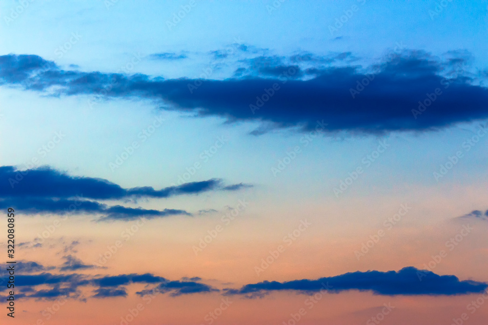 Fototapeta premium orange sunset sky with clouds. beautiful nature background