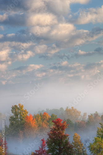 Foggy dawn landscape with dramatic sky at sunrise  Kalamazoo River Valley  Michigan  USA